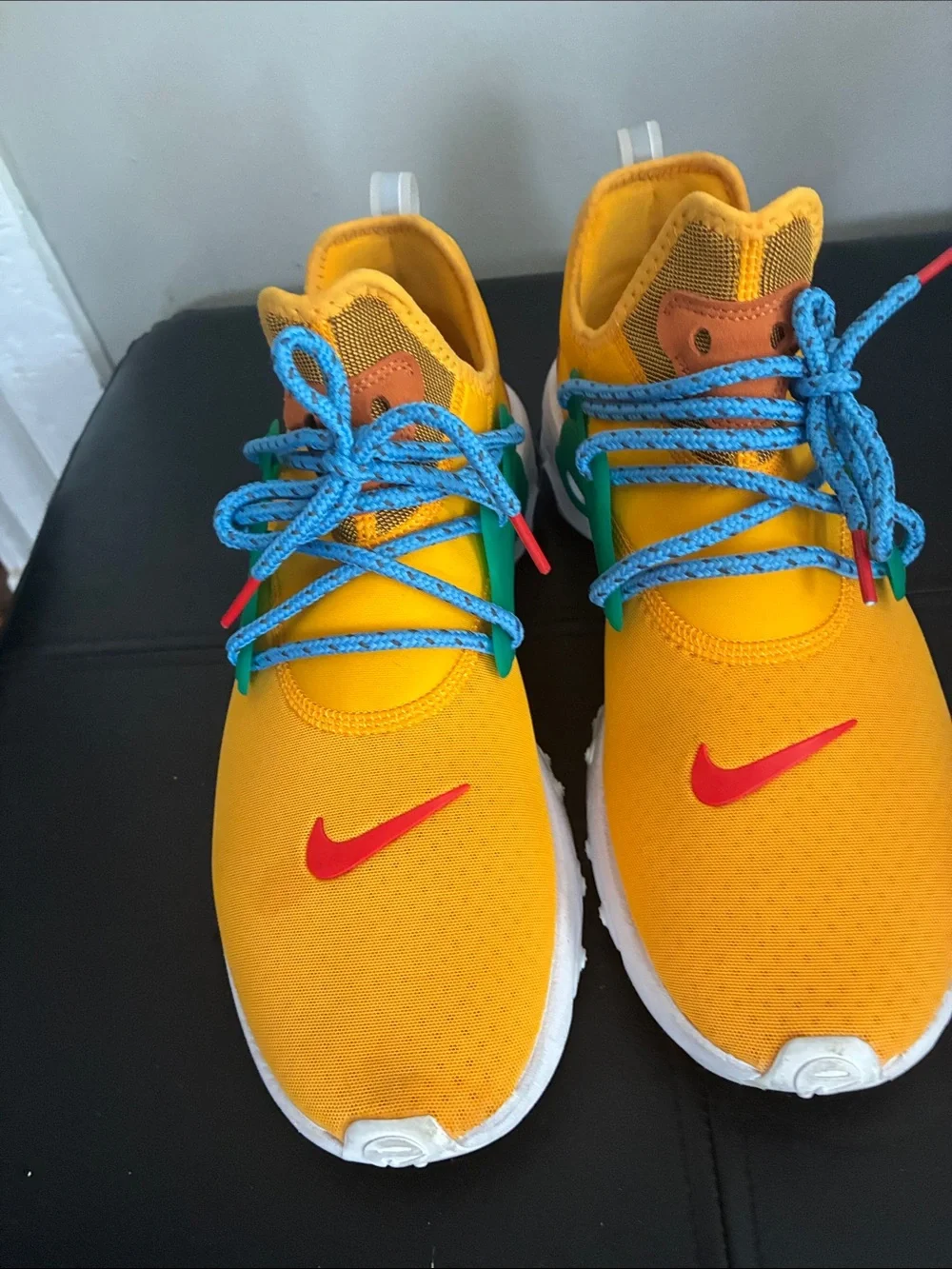 Nike Kids Yellow Sneakers with Blue Laces and Green Accents